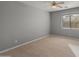 Bright bedroom with wood-look floors and large window at 4202 E Broadway Rd # 52, Mesa, AZ 85206