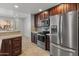 Modern kitchen with stainless steel appliances and wood cabinets at 4202 E Broadway Rd # 52, Mesa, AZ 85206