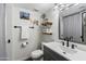 Stylish bathroom with gray vanity, modern fixtures, and decorative accents at 4641 W Palo Verde Ave, Glendale, AZ 85302