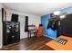 Small bedroom with a desk, safe, and ample closet space at 4641 W Palo Verde Ave, Glendale, AZ 85302