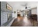Open concept dining area with a brick fireplace and access to the backyard at 4641 W Palo Verde Ave, Glendale, AZ 85302