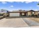 House with a two-car garage and a spacious driveway at 4641 W Palo Verde Ave, Glendale, AZ 85302