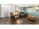 Cozy living room featuring dark hardwood floors and comfy seating at 4641 W Palo Verde Ave, Glendale, AZ 85302