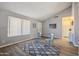 Living room with vaulted ceiling, wood-look floors, and rug at 5105 W Wood Dr, Glendale, AZ 85304