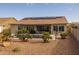 Backyard with covered patio, solar panels and spa at 5508 N 190Th Dr, Litchfield Park, AZ 85340