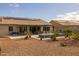 Landscaped backyard with patio, solar panels and spa at 5508 N 190Th Dr, Litchfield Park, AZ 85340