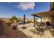 Relaxing backyard oasis with a spa, patio furniture, and mountain views at 5508 N 190Th Dr, Litchfield Park, AZ 85340