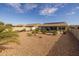Large backyard with gravel and a covered patio at 5508 N 190Th Dr, Litchfield Park, AZ 85340