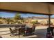 Covered patio overlooks a spa and mountain views at 5508 N 190Th Dr, Litchfield Park, AZ 85340