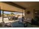 Covered patio with seating area, mountain views, and a spa at 5508 N 190Th Dr, Litchfield Park, AZ 85340