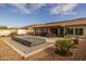 Large backyard with a covered patio, spa, and plenty of space for entertaining at 5508 N 190Th Dr, Litchfield Park, AZ 85340