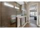 Walk-in shower with glass enclosure and modern tile at 5508 N 190Th Dr, Litchfield Park, AZ 85340