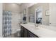 Clean bathroom with a tub shower combo and vanity at 5508 N 190Th Dr, Litchfield Park, AZ 85340