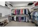 Large walk-in closet with ample shelving and hanging space at 5508 N 190Th Dr, Litchfield Park, AZ 85340