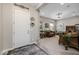 Bright entryway with decorative rug and view into living room at 5508 N 190Th Dr, Litchfield Park, AZ 85340