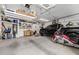 Spacious garage with overhead storage and work area at 5508 N 190Th Dr, Litchfield Park, AZ 85340