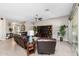 Spacious living room with comfortable leather furniture and large windows at 5508 N 190Th Dr, Litchfield Park, AZ 85340