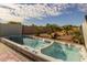 Relaxing backyard oasis with a swim spa and hot tub at 5508 N 190Th Dr, Litchfield Park, AZ 85340
