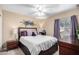 Cozy bedroom with a queen-size bed and window at 62 W Melody Dr, Gilbert, AZ 85233