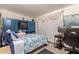 Bedroom with a bed, a built-in media cabinet, and a workspace at 633 W 1St St, Mesa, AZ 85201