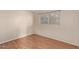 Bedroom with wood-look floors and window at 633 W 1St St, Mesa, AZ 85201