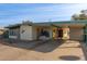 Ranch style home with carport and front yard at 633 W 1St St, Mesa, AZ 85201