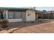 Mid-century modern house with carport and landscaped yard at 633 W 1St St, Mesa, AZ 85201