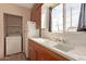 Kitchen with double sink and laundry closet at 633 W 1St St, Mesa, AZ 85201