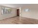 Living room with wood-look floors and access to exterior at 633 W 1St St, Mesa, AZ 85201