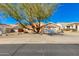 Single-story home with a landscaped yard and a two-car garage at 6436 E Virginia St, Mesa, AZ 85215