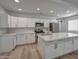 Modern kitchen featuring white cabinets, quartz countertops, and a large island at 66 W Brooks St, Gilbert, AZ 85233