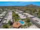 Aerial view of community, showcasing numerous homes and a central pool area at 7153 N Via De Paesia --, Scottsdale, AZ 85258