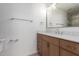 Modern bathroom with wood vanity, quartz countertop, and frameless shower at 7153 N Via De Paesia --, Scottsdale, AZ 85258