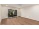 Light and airy bedroom with sliding door to patio and wood-look floors at 7153 N Via De Paesia --, Scottsdale, AZ 85258