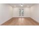 Bright bedroom with hardwood floors and French doors leading outside at 7153 N Via De Paesia --, Scottsdale, AZ 85258
