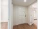 Bright entryway with white door and light brown wood flooring at 7153 N Via De Paesia --, Scottsdale, AZ 85258