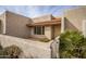 Light tan stucco condo with a charming entryway and nicely kept landscaping at 7153 N Via De Paesia --, Scottsdale, AZ 85258