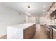 Modern kitchen with island, stainless steel appliances, and light wood cabinets at 7153 N Via De Paesia --, Scottsdale, AZ 85258