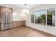 Bright kitchen features light wood cabinets and a view of the backyard at 7153 N Via De Paesia --, Scottsdale, AZ 85258