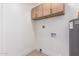Laundry room with upper cabinets and hookups at 7153 N Via De Paesia --, Scottsdale, AZ 85258
