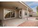 Covered patio, sliding glass door, and brick pathway at 7153 N Via De Paesia --, Scottsdale, AZ 85258