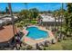 Inviting community pool with surrounding patio furniture and landscaping at 7153 N Via De Paesia --, Scottsdale, AZ 85258