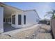 Landscaped backyard with paved pathway and rock features at 7278 W Via Montoya Dr, Glendale, AZ 85310
