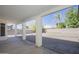 Covered patio overlooks a spacious backyard with gravel and a brick paved area at 7278 W Via Montoya Dr, Glendale, AZ 85310