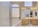 Elegant bathroom with double sinks, soaking tub, and separate shower at 7278 W Via Montoya Dr, Glendale, AZ 85310