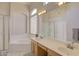 Spa-like bathroom with double sinks, soaking tub, and shower at 7278 W Via Montoya Dr, Glendale, AZ 85310