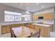 Eat in kitchen with island, wood cabinets, and stainless steel appliances at 7278 W Via Montoya Dr, Glendale, AZ 85310