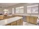 Kitchen with an island, wood cabinets, and stainless steel appliances at 7278 W Via Montoya Dr, Glendale, AZ 85310
