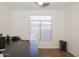 Functional home office with built-in desk and window at 7278 W Via Montoya Dr, Glendale, AZ 85310