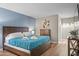 Main bedroom with a king-size bed, dresser, and access to the bathroom at 7625 E Camelback Rd # B148, Scottsdale, AZ 85251